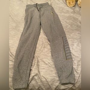 This is a men’s small puma jogger tried on condition in a grey and yellow color